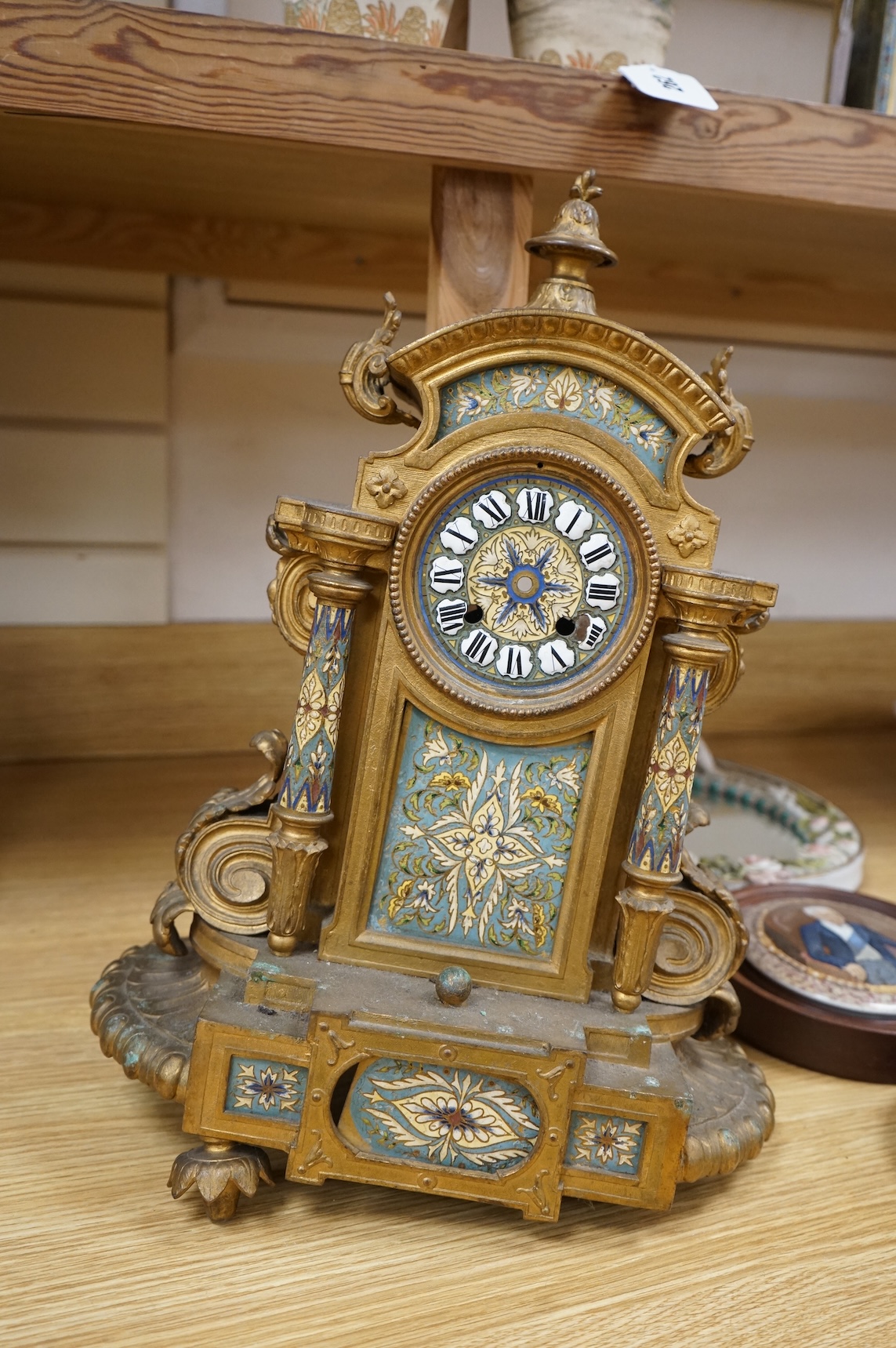 A French gilt metal and champleve enamel clock, 41cm